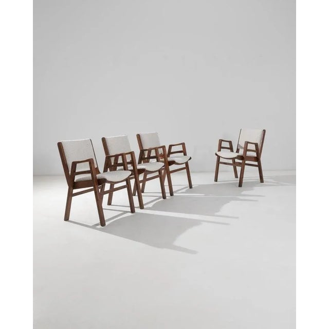 This beautiful set of four wooden armchairs epitomizes the Czech Modern style. Made in the 1950s, the form is both graphic...