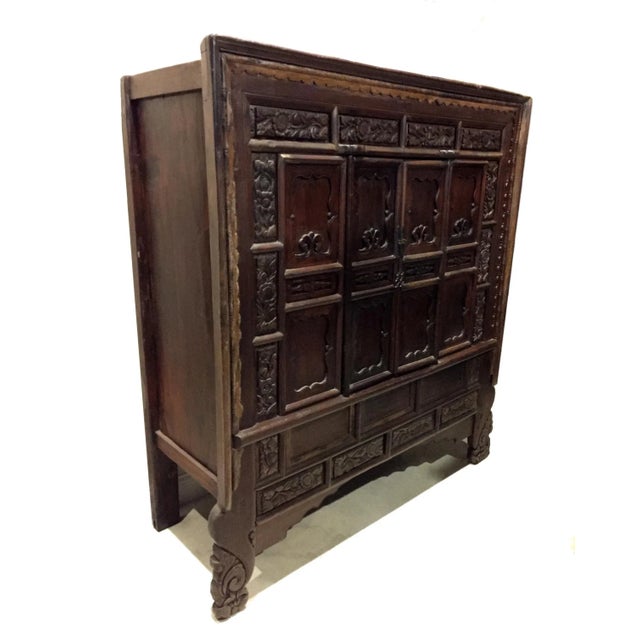 This massive cabinet is from Shan Xi province, China's ancient frontier and trade post. Commanding at over 5' wide with...