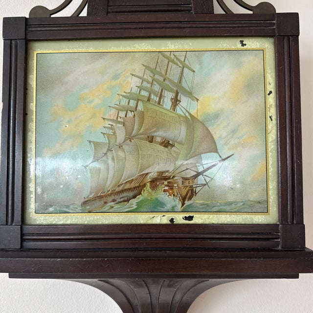 Early 20th century American banjo clock crafted by the Sessions Clock Company of Forestville, CT. The piece exemplifies...