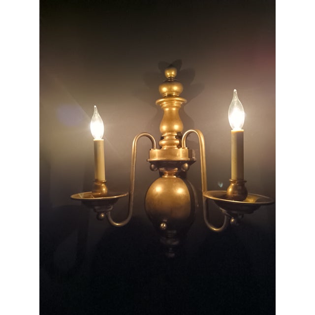 Dutch Baroque-style (also known as Dutch Colonial or Flemish) two-light solid brass wall sconce. Characterized by its...