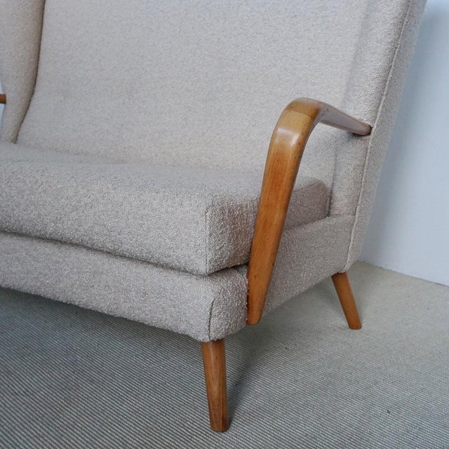 A mid-century 'bambino' sofa designed by howard keith for hk furniture. Solid beech, re-upholstered in bouclé. Dimensions:...