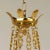 The ornate decoration on the arms, and the arrangement of the chains demonstrate exceptional casting in brass. With...