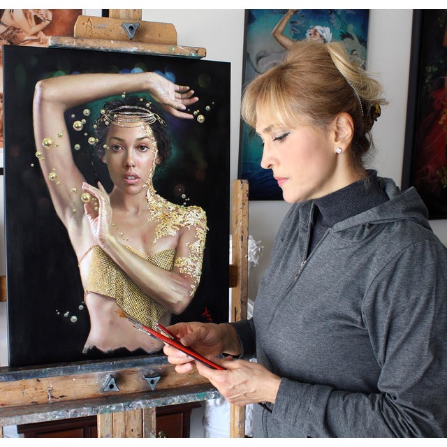 This artwork features a figure adorned in shimmering gold accents, evoking a sense of ethereal beauty and transcendence....