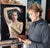 This artwork features a figure adorned in shimmering gold accents, evoking a sense of ethereal beauty and transcendence....