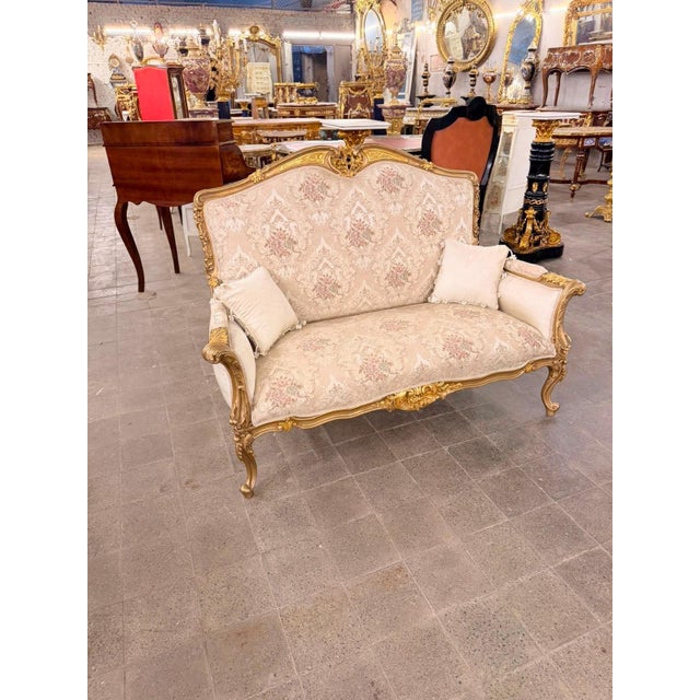 Bring the elegance of a French salon into your home with this exceptional Louis XV-style Rococo canapé loveseat,...