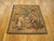 A framed French rustic tapestry from the 18th century, envisioning a pedant seated on a barrel, instructing a group...