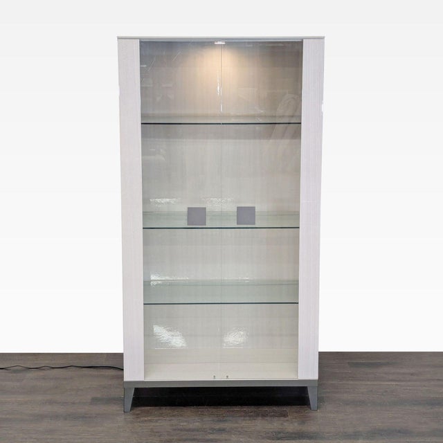 Wood electrified cabinet with 2 glass doors, 3 glass shelves, and metal hardware. Brand: Alf Italia. Dimensions (in): 38W...