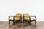 A pair of club chairs "type B7522," designed by Zenon Bączyk and produced in Poland in the 1960s, exemplifies the...