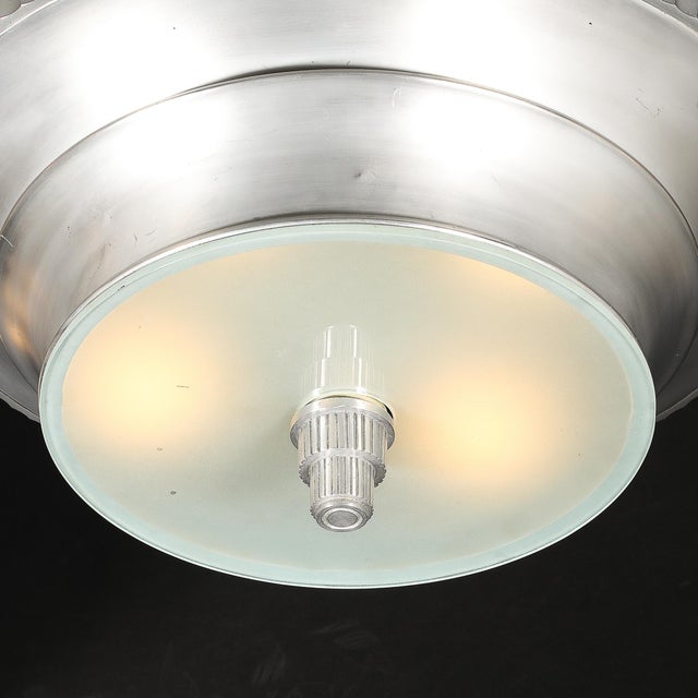 This striking Art Deco Brushed Aluminum & Frosted Glass Chandelier with Fluted Detailing originated in the United States,...