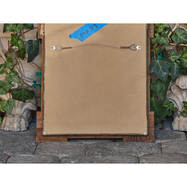 Petite in scale but bold in personality, this early 20th-century French Tramp Art mirror delivers hand-carved intricacy in...
