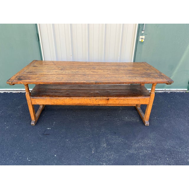 From the early 1800s, a stunning antique American oak hutch table. Weathered and age-worn rustic oak displays wonderful...