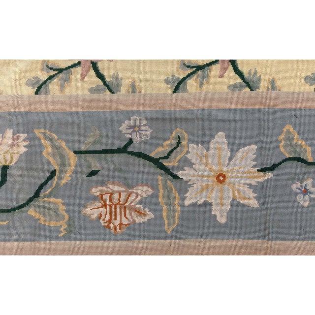 This exceptional vintage Portuguese needlepoint rug, crafted circa 1940, exemplifies the rich textile heritage of...