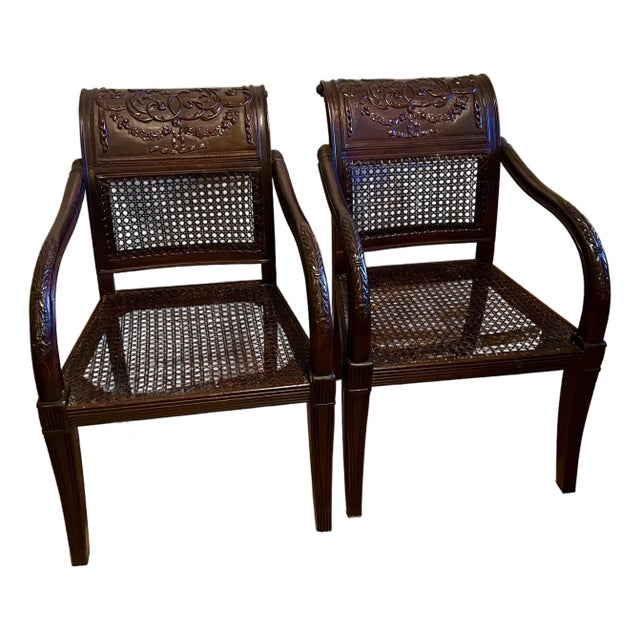A pair of Regency Style Carved Mahogany and Cane armchairs in excellent condition.