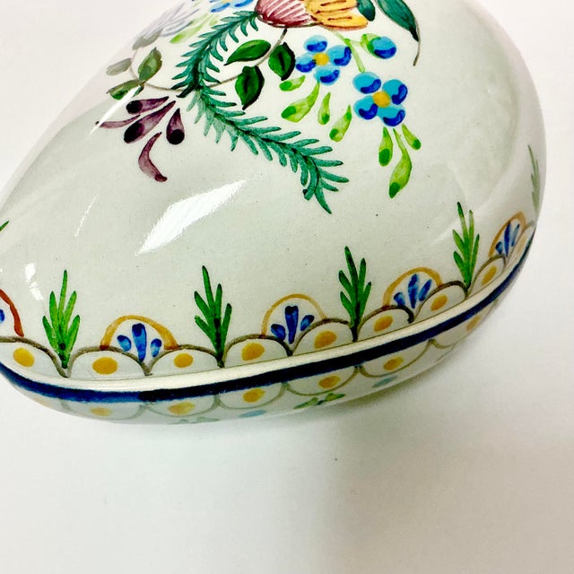 This Porcelain Box is from Portugal. It’s Egg shaped and beautifully hand-painted. The lower compartment is enhanced with...