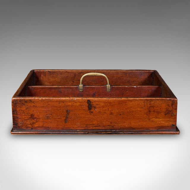 This is an antique butler's work box. An English, mahogany and fruitwood country house carry, dating to the Georgian...