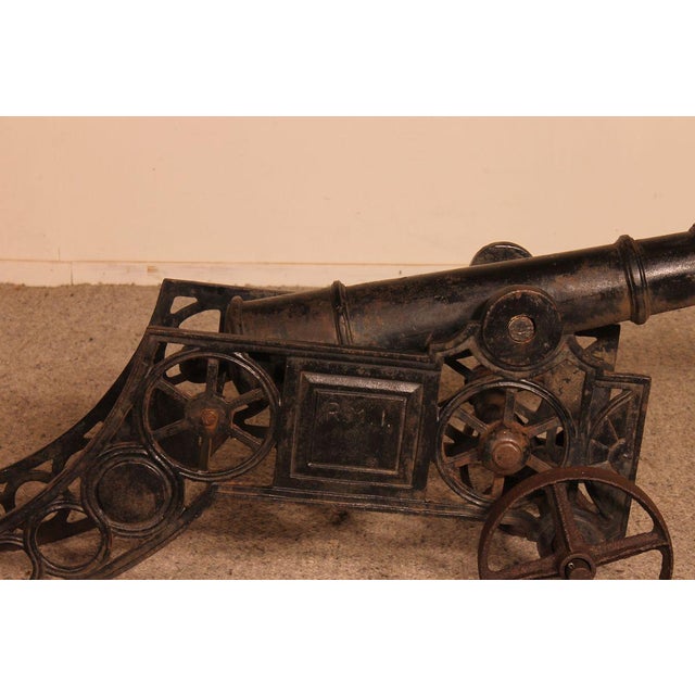 Elegant late 19th century / early 20th century cast iron cannon from England. We can find the inscription RM1 on its side...