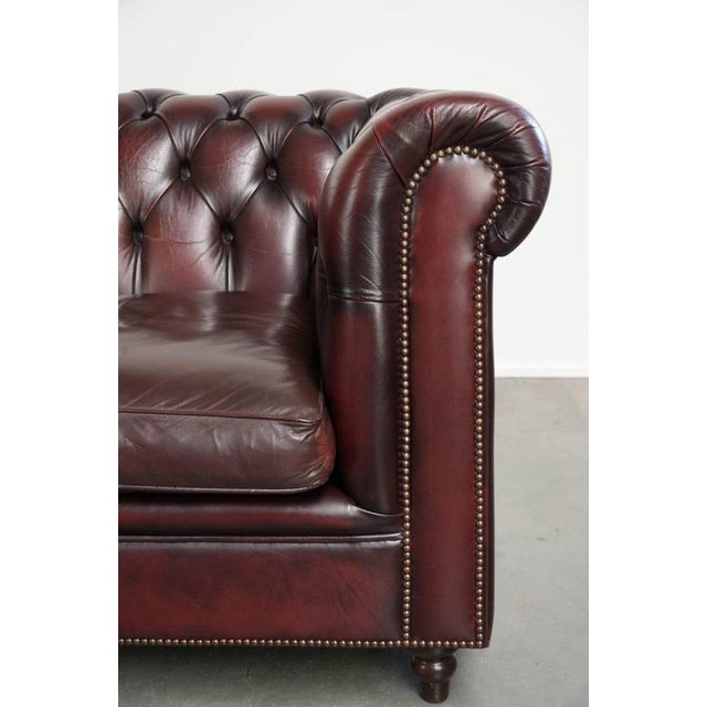 Cowhide Chesterfield 2.5-Seater Sofa in Oxblood Red For Sale - Image 9 of 14
