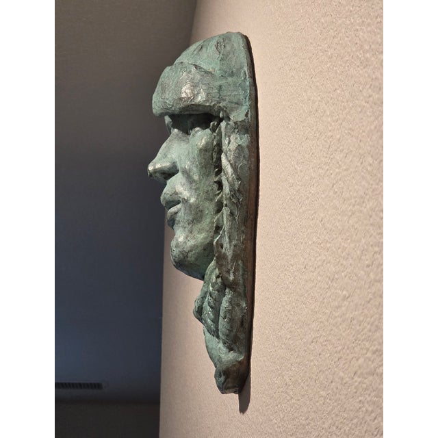 Expressive vintage studio wall mask created and signed by American sculptor Len Shartle (1944–2012). Rendered in cold-cast...