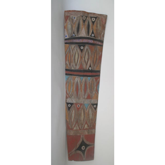 This stunning, one-of-a-kind piece, is hand-painted with tribal markings on a large piece of bark. It looks amazing either...