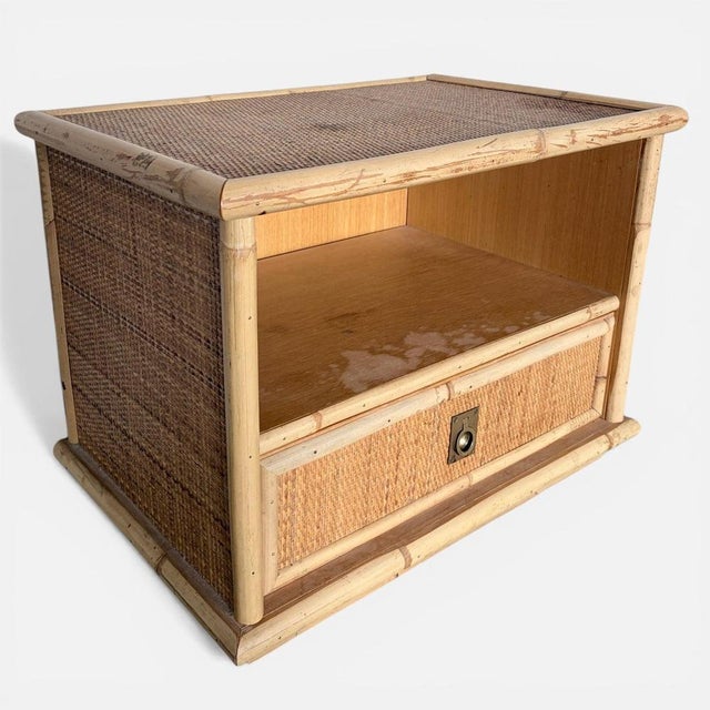 A beautifully styled Italian Dal Vera bamboo bedside table, showcasing the relaxed elegance of mid-century Mediterranean...