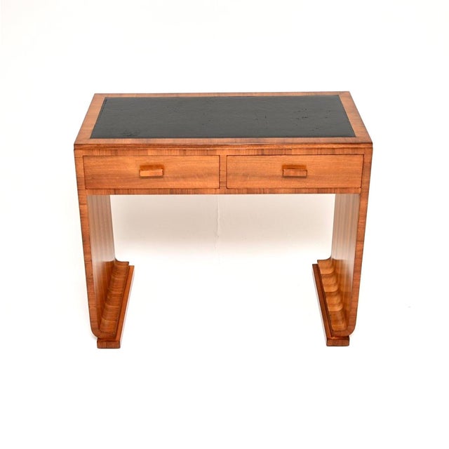 A gorgeous Art Deco walnut leather top desk, made in England and dating from the 1930’s. It is of amazing quality, it is...