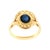 A late 20th-century 18k gold ring featuring a central cabochon-cut blue sapphire, weighing approximately 2.0 carats....