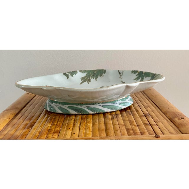 Vintage Chinoiserie pedestal dish. Hand painted scene. Pretty greens and pink. Gilded edge. Nice on a coffee table/console...