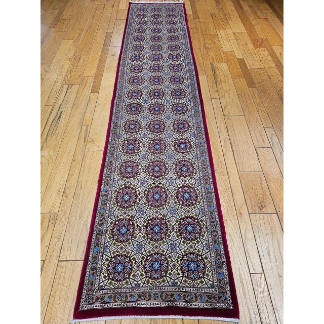 "This vintage Persian Qum runner is a rare allover design. Handwoven in the renowned weaving center of Qum, this runner...