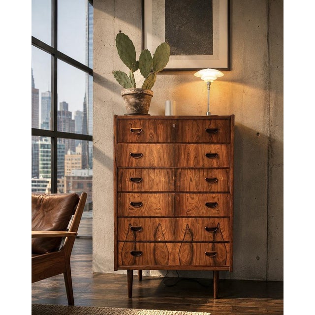 Danish highboy executed by a danish cabinetmaker during the 1960s. the cabinet features six drawers with sculpted recessed...