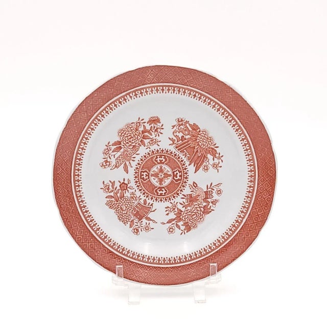 A set of twelve orange Spode Fitzhugh bread and butter plates, made in England.