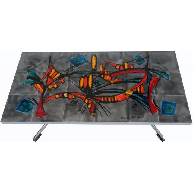 French rectangular coffee table. Solid polished iron and original tiles. Signed VALLAURIS " LA GRANGE" on the tiles.