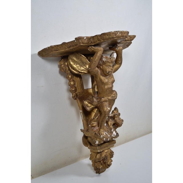 Mid 18th Century France XVIIIth Century Small Wall Bracket in Stuccoed and Gilded Wood, the Scalloped Top Supported by Zéphir For Sale - Image 5 of 13