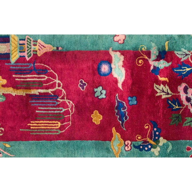 A charming early 20th century Chinese Art Deco rug with a cranberry field featuring a multi-colored whipping willow tree...