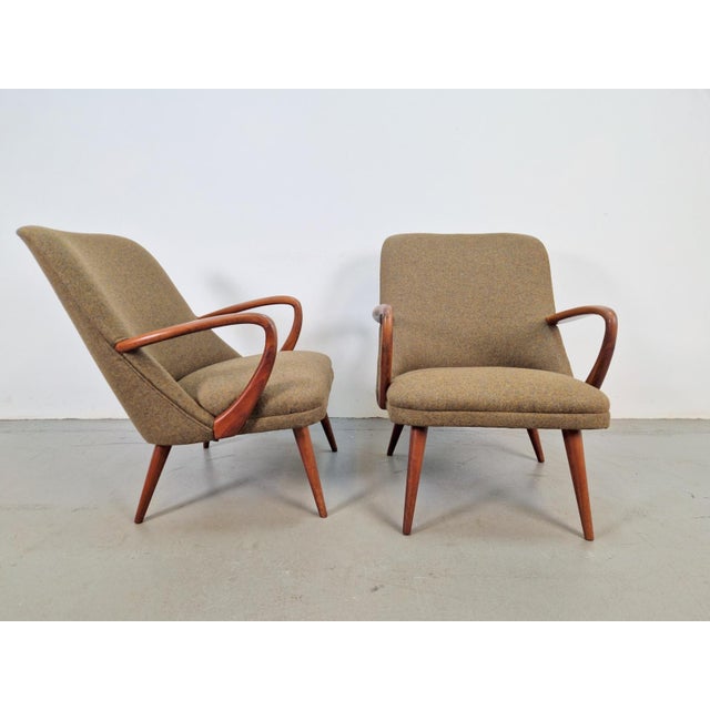 Pair of vintage beech wood armchairs and footstool Scandinavian design Completely reupholstered and in beautiful condition...