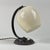 This art deco table lamp or bedside light was designed and manufactured in germany in the 1930s during the bauhaus period....