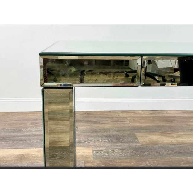 Sophisticated West Elm mirrored console table featuring a sleek rectangular silhouette, beveled mirrored panels, and a...