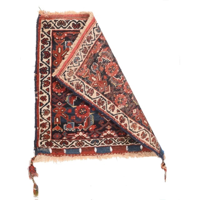 This attractive nomadic artefact shows a navy ground filled by a single Herati motif detailed in red, light-medium blue,...