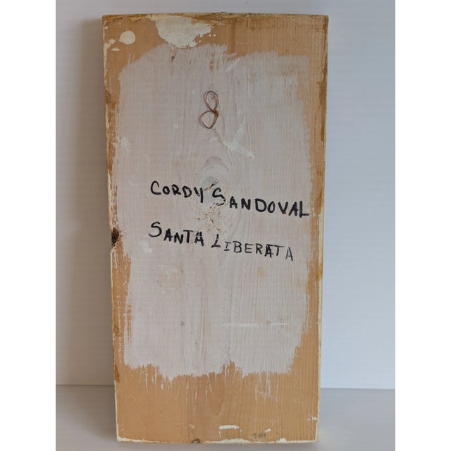 Naive retablos are painted by children. Cordy Sandoval (b1977) painted this retablo of Santa Liberata when she was 14...