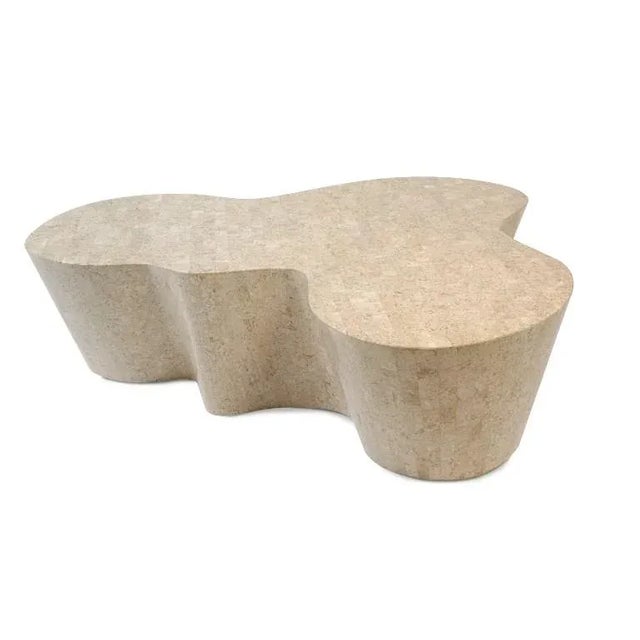 Indulating, award-winning shape veneered with fossil stone.