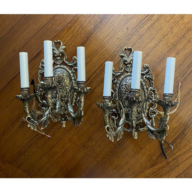 Dated to the 19th century, is this pair of wall sconces in the style & era and craftsmanship of that which commands...