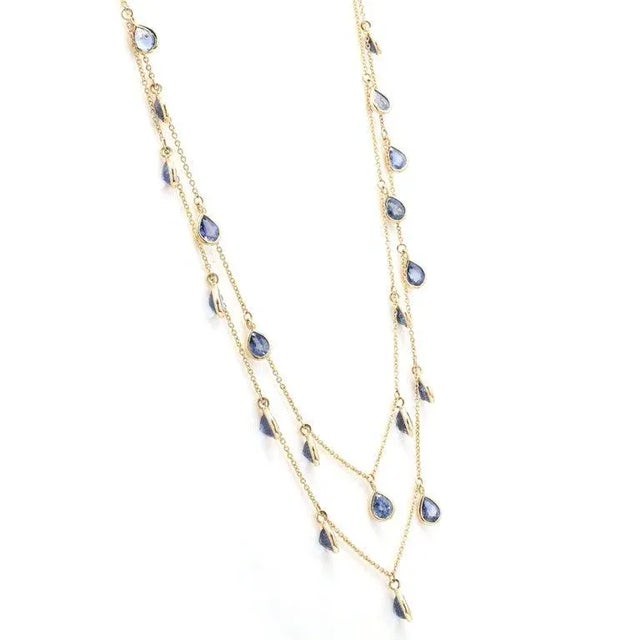This is part of Chairish’s Fine Jewelry assortment. Sapphire Two Strand Chain Necklace studded with pear cut sapphire in...
