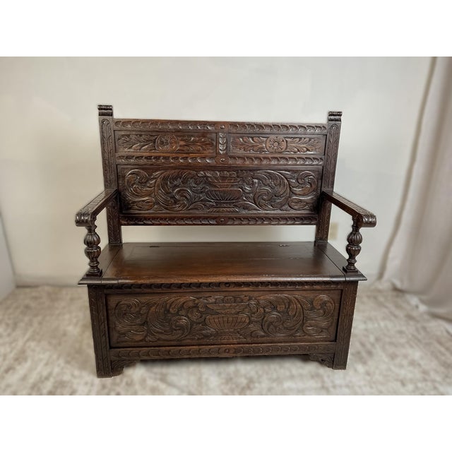 This antique French Normandy bench chest is an exceptional example of regional oak craftsmanship, distinguished by its...