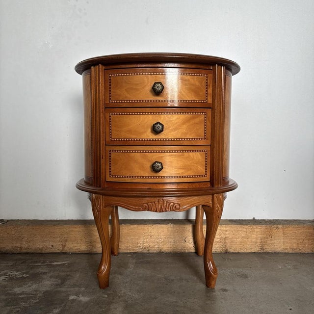 This elegant side table is a high-quality piece in the Louis XV style. Featuring fine inlay work, gently curved lines, and...