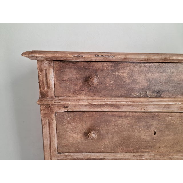 A unique piece! This tall chest of drawers, also known as a "weekly chest" because it has seven drawers: one for each day...
