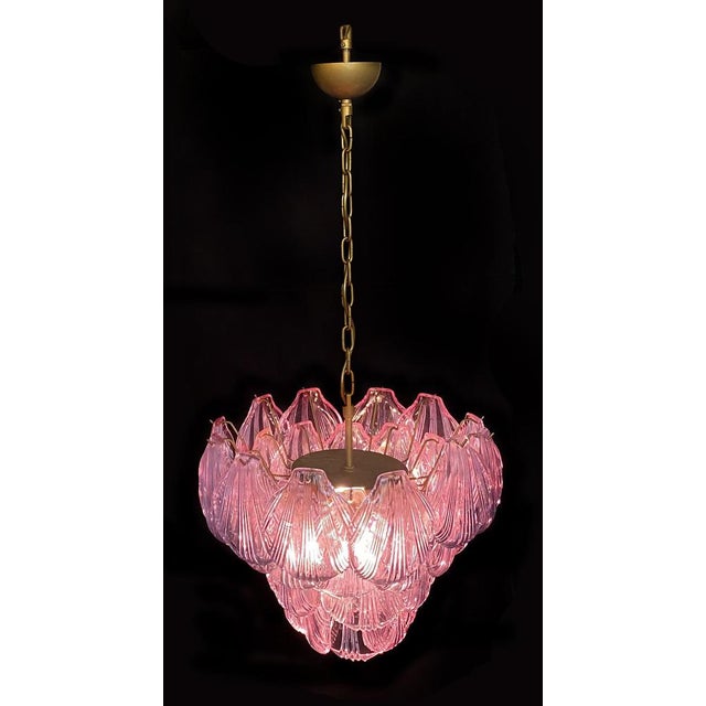 Fantastic pair of chandeliers with pink glasses, gold painted metal frame. It has 36 shell glass. The glasses are very...