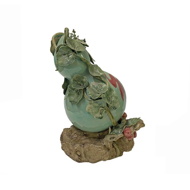 This is an artistic light green color oriental gourd shape ceramic display figure. It has a very precise delicate details...