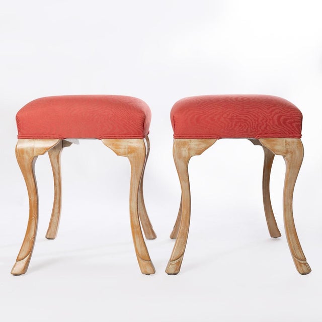 A pair of traditional William Switzer benches or stools with stylised hoof feet.