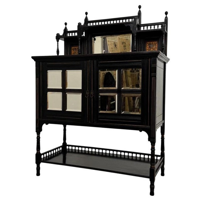 An exceptional 19th-century English cabinet from the Aesthetic Movement, distinguished by its dramatic ebonised finish,...