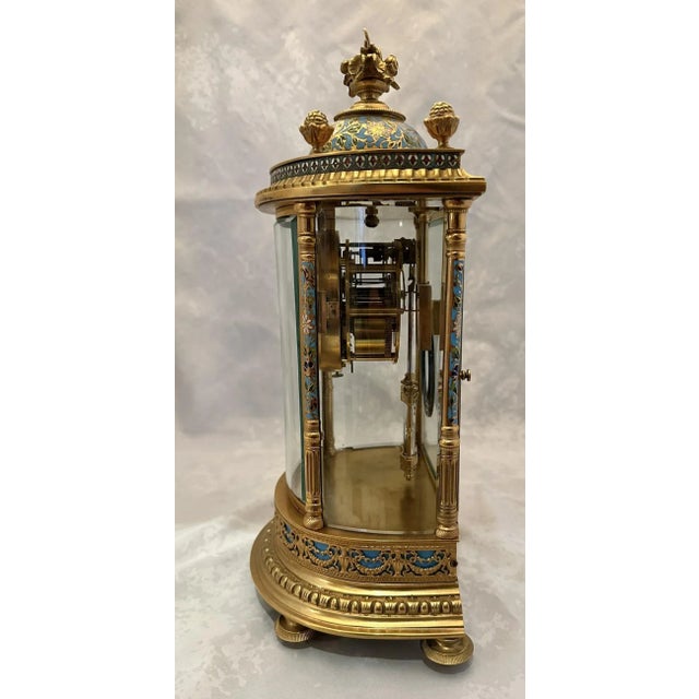 French crystal regulator clock. Brass case with curved glass door and glass sides. Cloisonne details to case and dial....