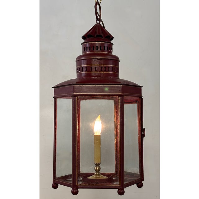 A large American early to mid 19th century red tole painted lantern. In excellent condition, repainted sometime in the mid...